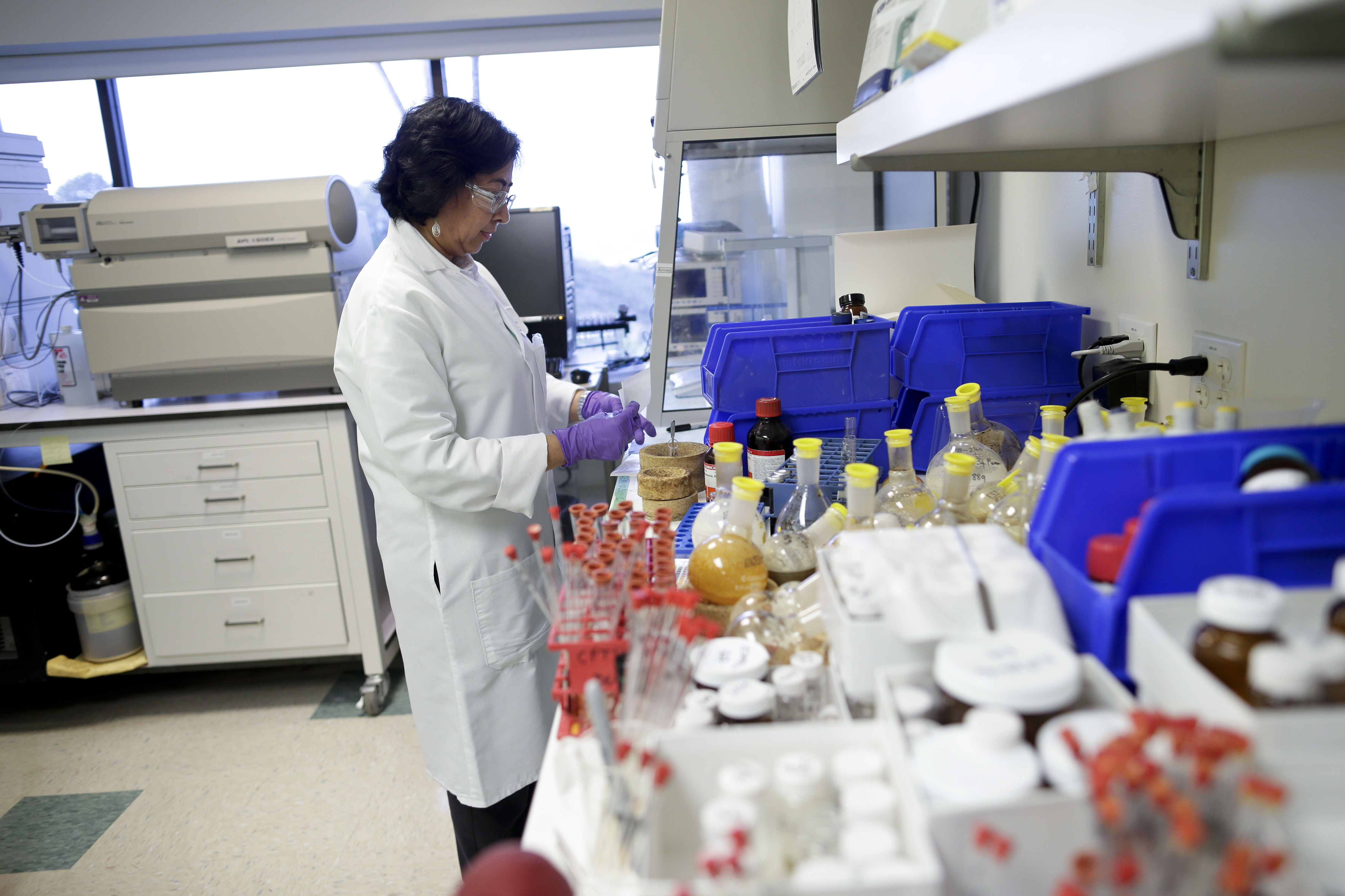 A scientist at Vertex Pharmaceuticals works in a laboratory in San Diego, California, on March 4, 2015.