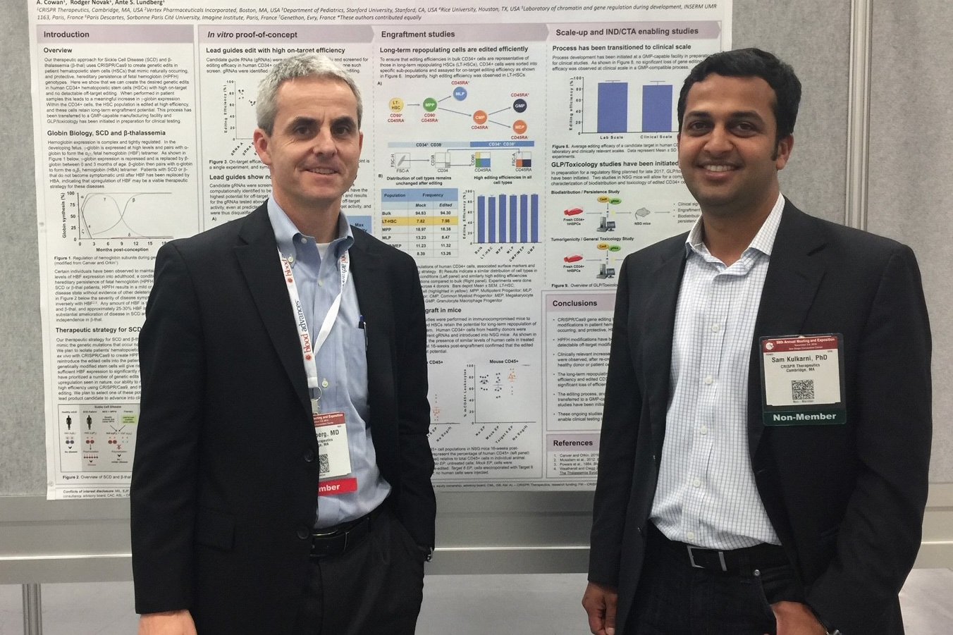 Samarth Kulkarni and Bill Lundberg stand in front of a research poster at the American Society of Hematology’s annual meeting in 2016.